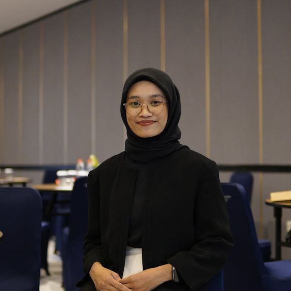 Portrait of a smiling, confident woman in sportswear.